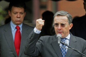 Colombian President Alvaro Uribe (R) del